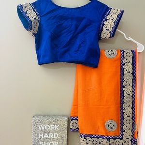 Orange saree with contrast blue blouse